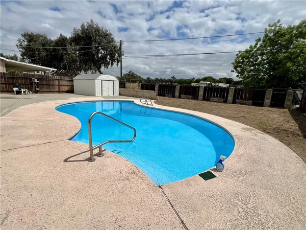 a view of a swimming pool with a patio