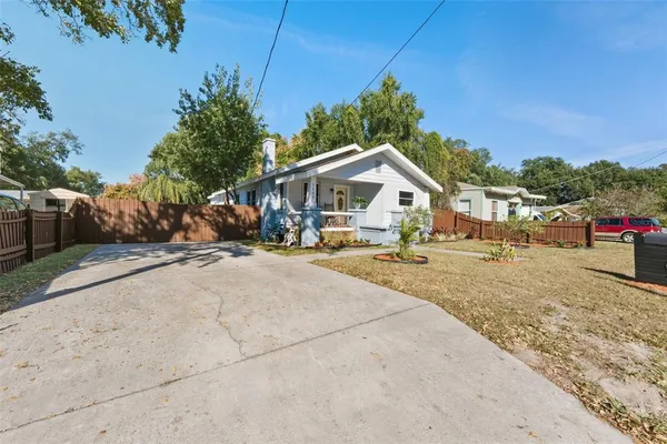 a view of the house with a yard