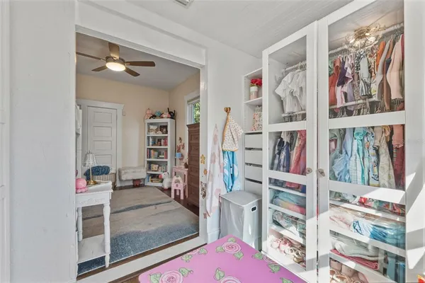 a bedroom with a bed and a couch