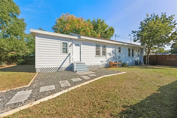 aerial view of a house with swimming pool and sitting area