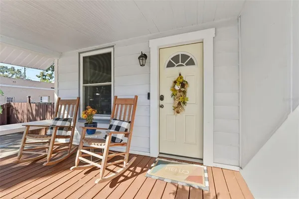 a view of living room with furniture and wooden floor
