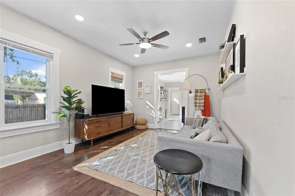 a living room with furniture and a flat screen tv