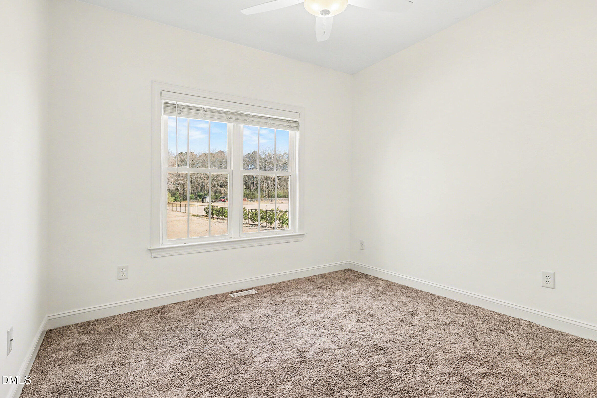 5117 Joe Ellen Road Battleboro, NC 27809 - Photo 13 of 23 an empty room with a window