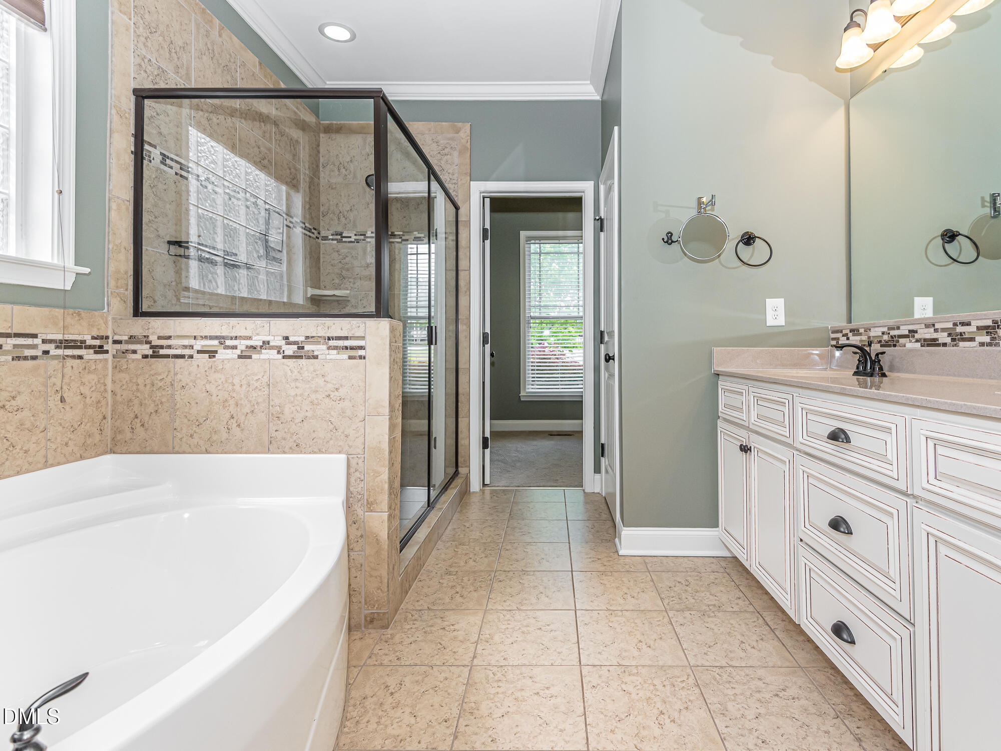337 Shadowdale Lane Rolesville, NC 27571 - Photo 19 of 42 a bathroom with a tub sink and mirror