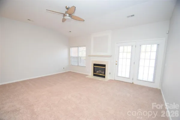 a kitchen with stainless steel appliances granite countertop a sink a stove a microwave a counter top space and cabinets
