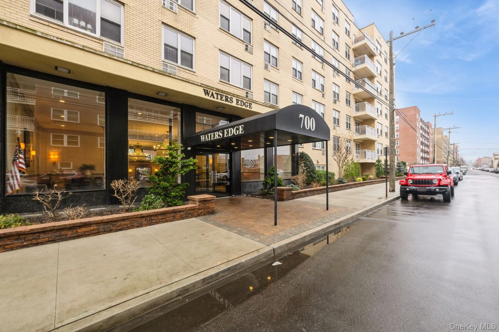 700 Shore Road, Unit 4O Long Beach, NY 11561 - Photo 1 of 42 a view of a building with car parked