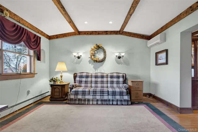 a livingroom with furniture and window