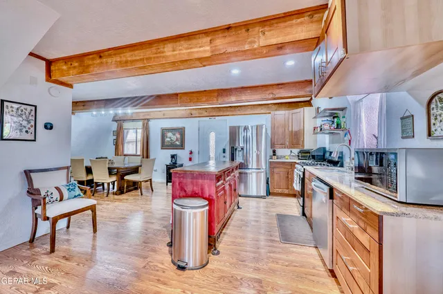 a lobby with furniture and a rug