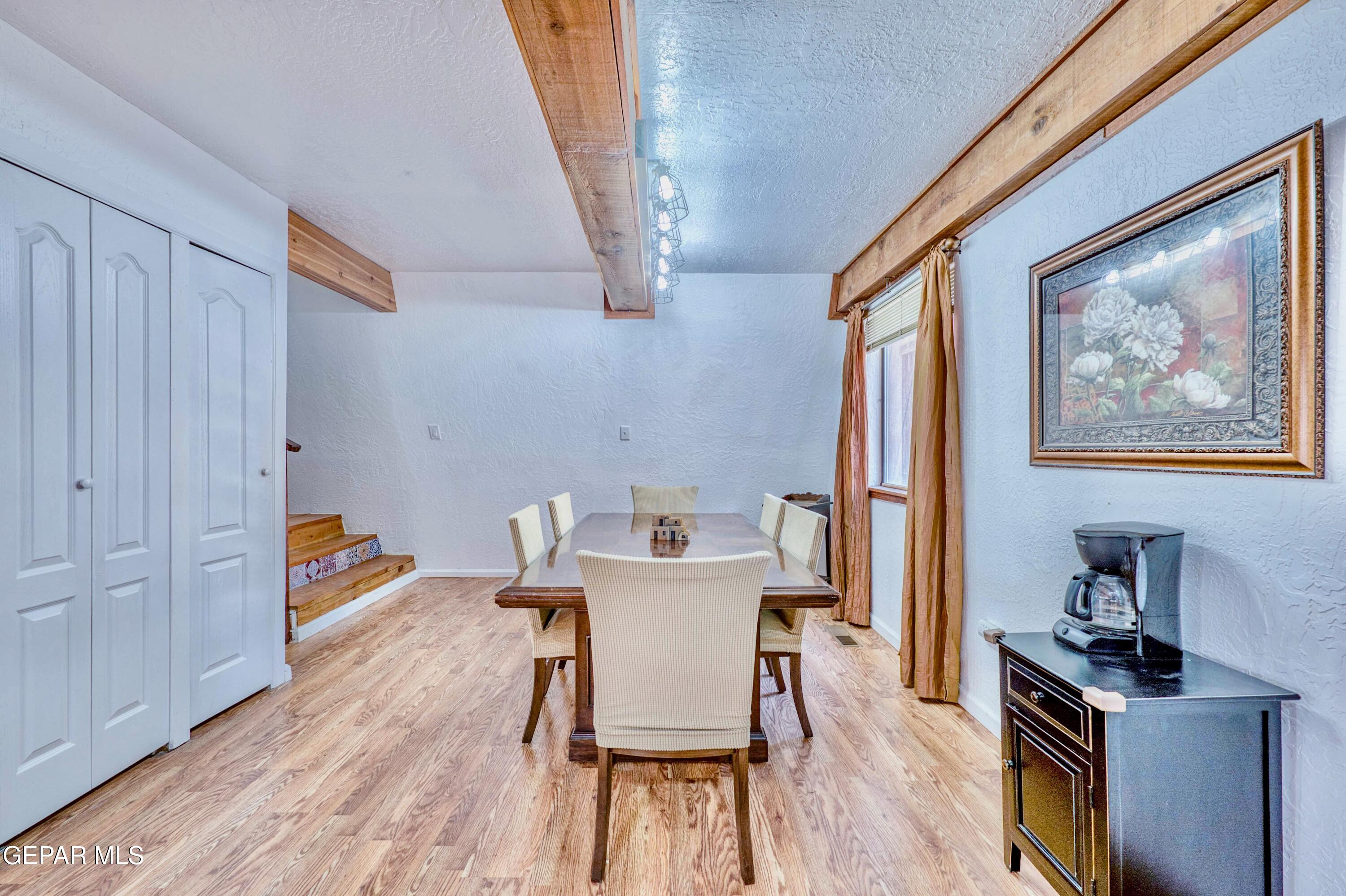 104 Meadow Wood Ruidoso, NM 88345 - Photo 26 of 55 a workspace with furniture and wooden floor