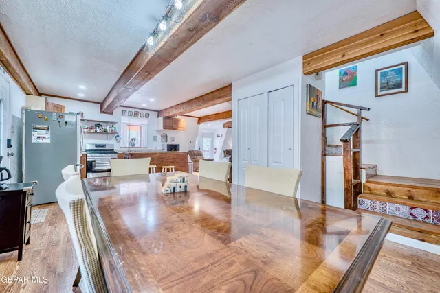 a view of a dining room with furniture and wooden floor