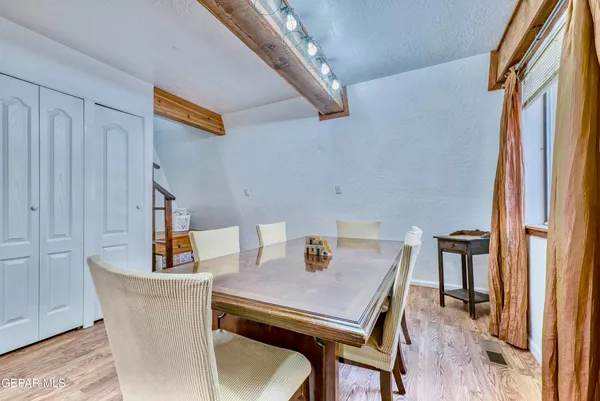 a bedroom with bed and a window