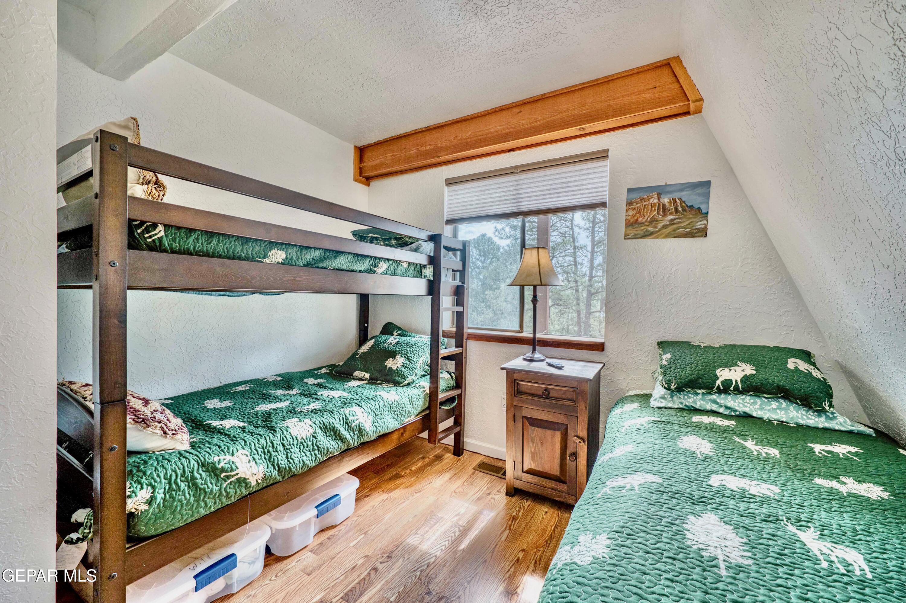 104 Meadow Wood Ruidoso, NM 88345 - Photo 32 of 55 a front view of a house with a yard