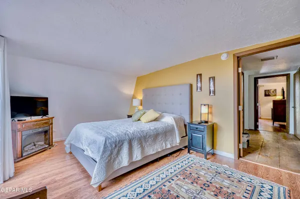 a bedroom with a bed and a couch