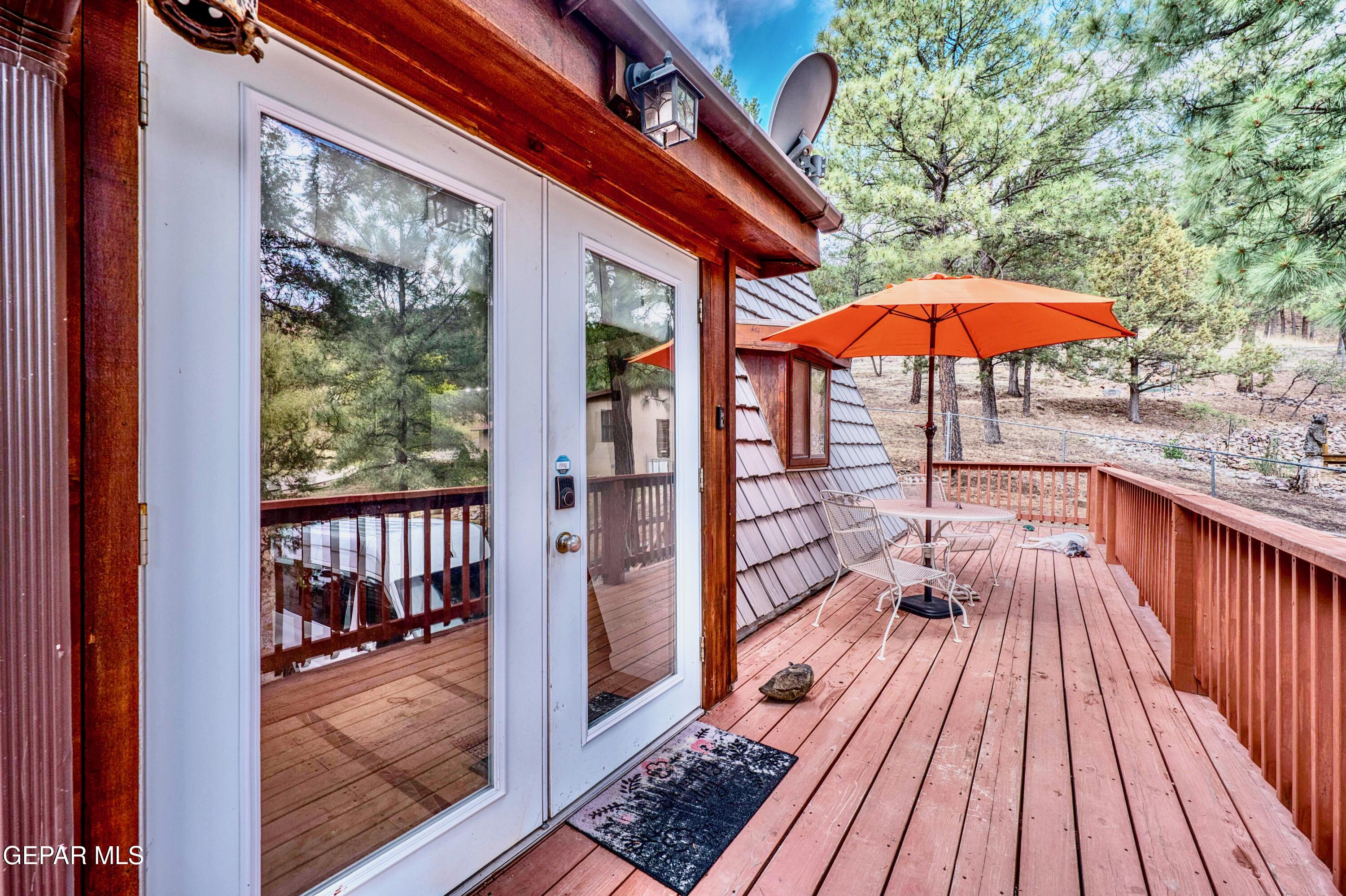104 Meadow Wood Ruidoso, NM 88345 - Photo 8 of 55 a view of balcony with wooden floor