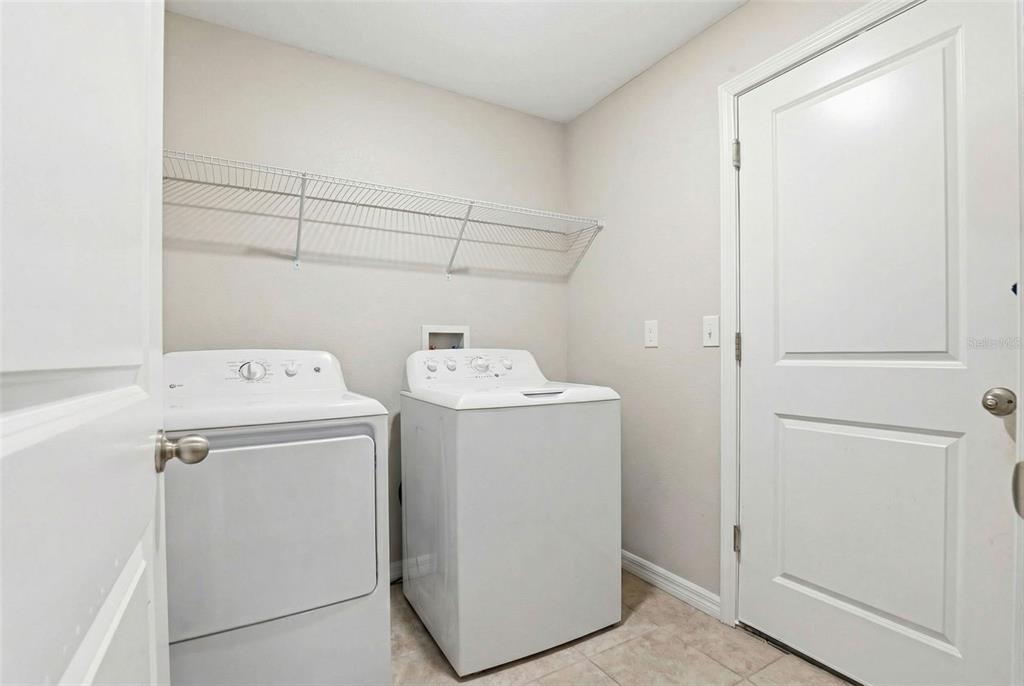211 English Channel Place Dover, FL 33527 - Photo 13 of 35 a utility room with dryer and washer