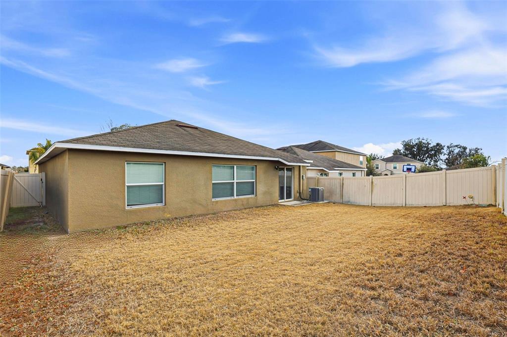 211 English Channel Place Dover, FL 33527 - Photo 32 of 35 a front view of a house with a yard