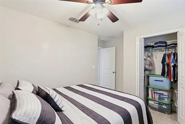 a bedroom with a bed and closet