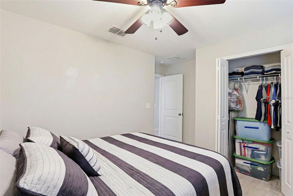 211 English Channel Place Dover, FL 33527 - Photo 7 of 35 a bedroom with a bed and closet