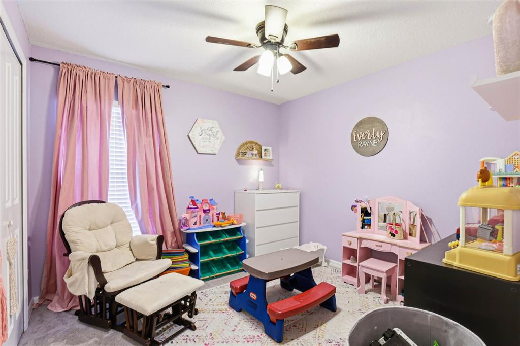 211 English Channel Place Dover, FL 33527 - Photo 9 of 35 a living room with furniture and a window