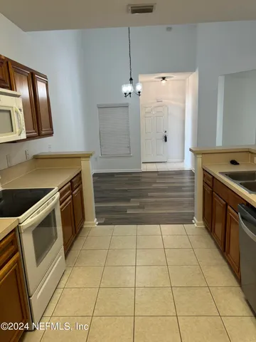 a kitchen with a stove and a sink