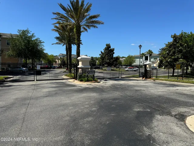 a view of street with palm trees
