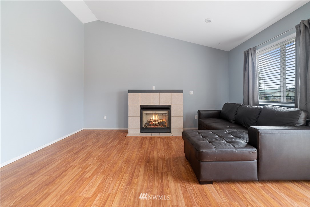 18011 Daryl Lane Southwest Rochester, WA 98579 - Photo 14 of 31 a living room with furniture and a fireplace