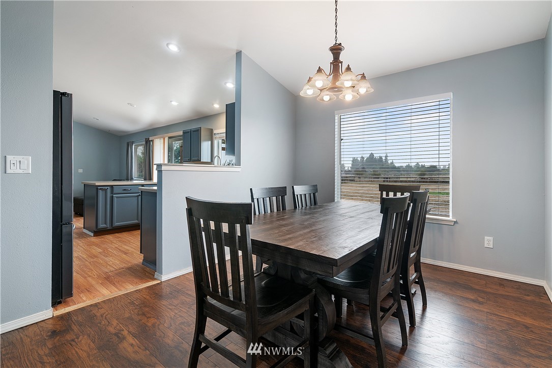 18011 Daryl Lane Southwest Rochester, WA 98579 - Photo 15 of 31 a view of a dining room with furniture window and wooden floor