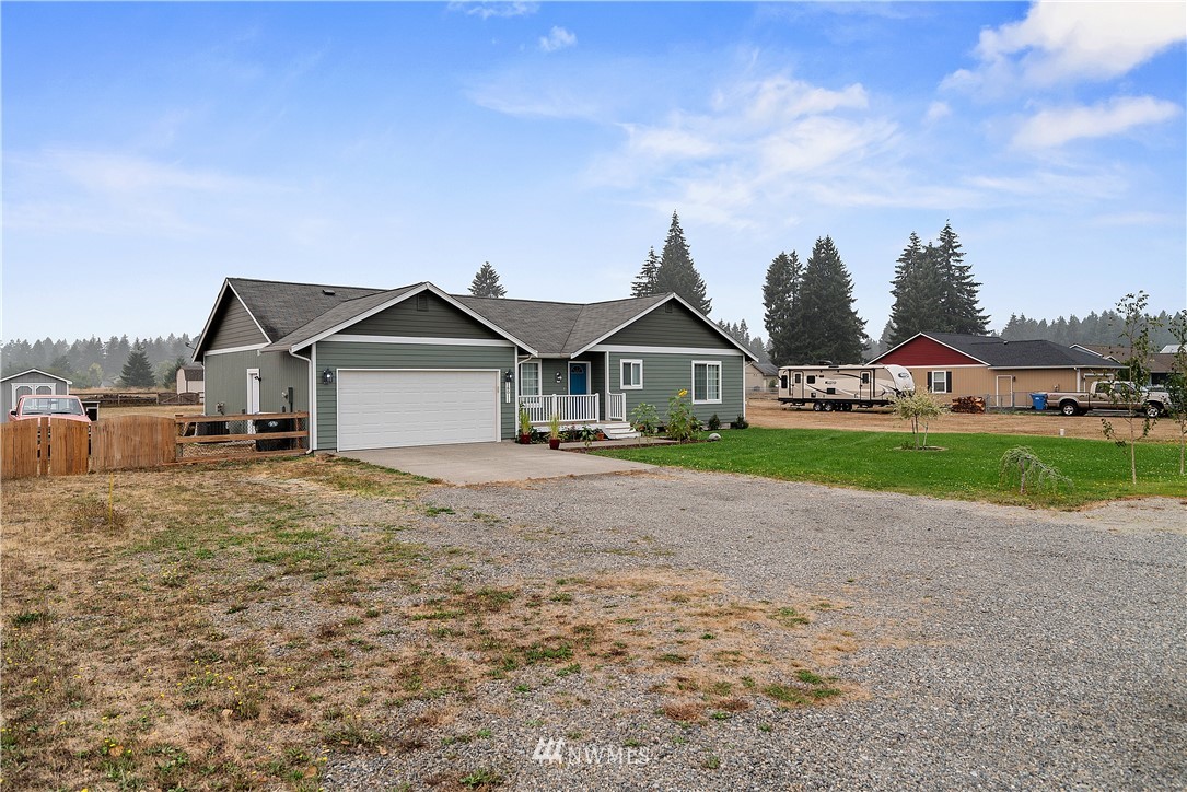 18011 Daryl Lane Southwest Rochester, WA 98579 - Photo 3 of 31 a view of house with garden and entertaining space