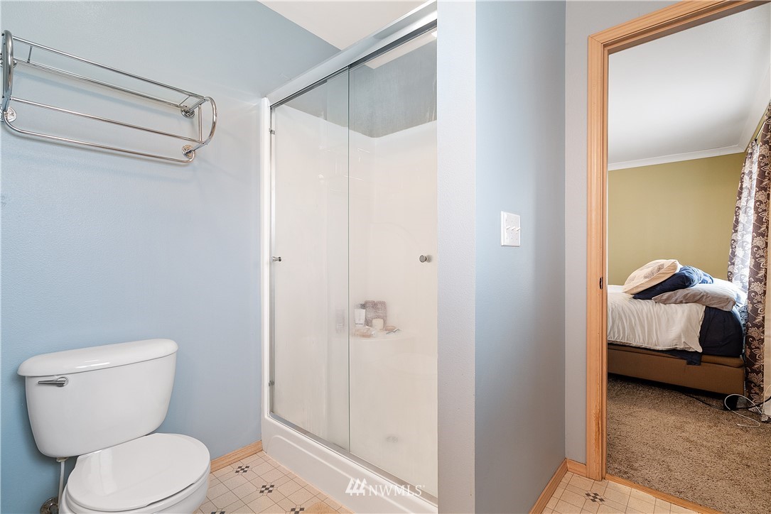 18011 Daryl Lane Southwest Rochester, WA 98579 - Photo 22 of 31 a bathroom with a toilet and a shower