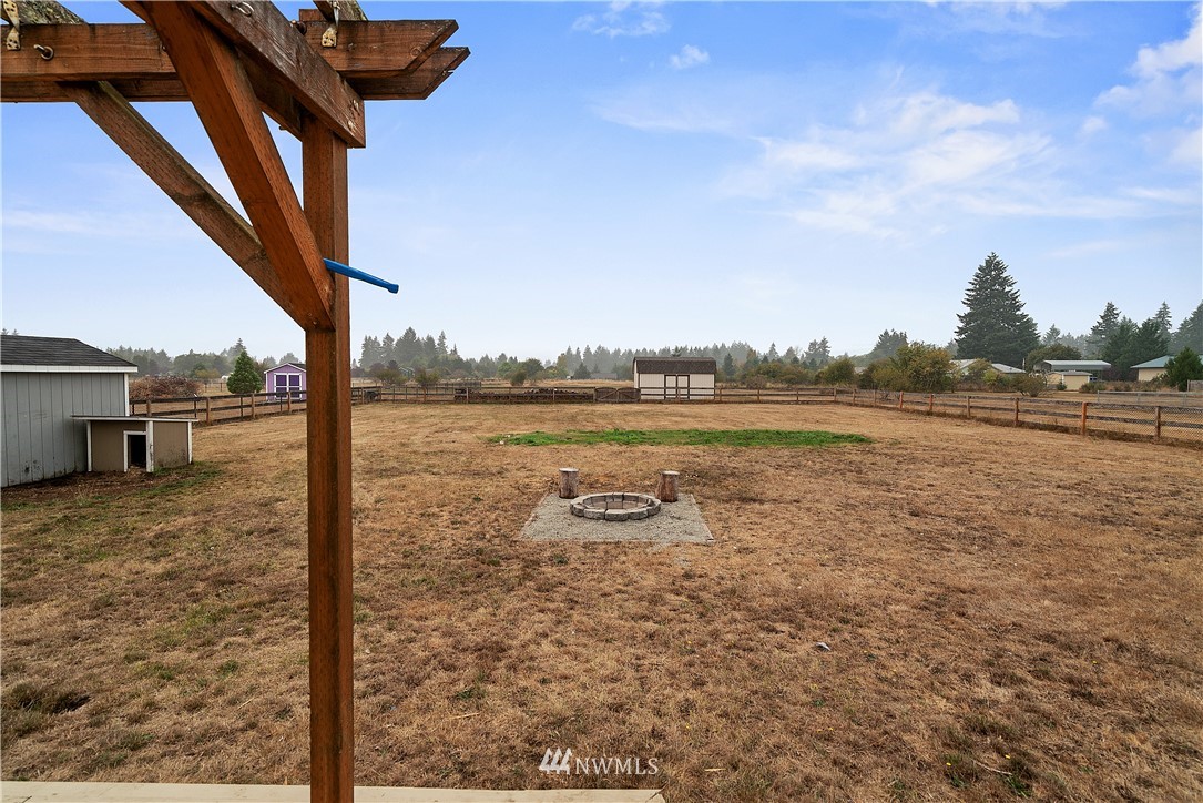 18011 Daryl Lane Southwest Rochester, WA 98579 - Photo 29 of 31 a view of a lake with houses in the background