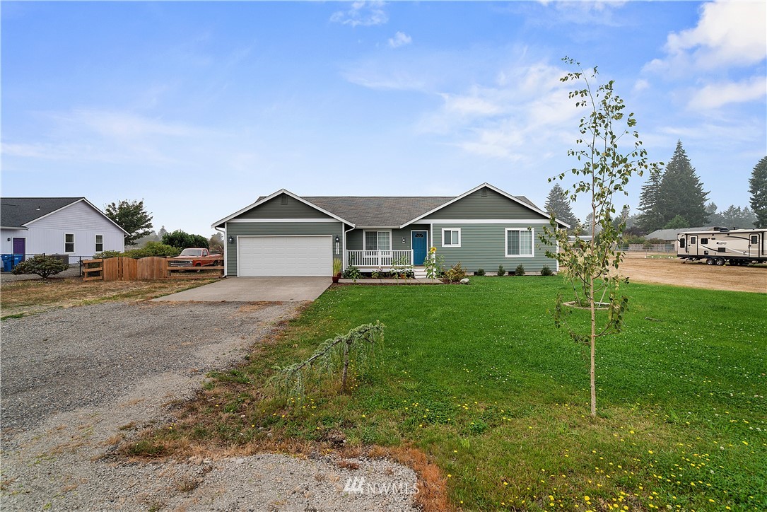 18011 Daryl Lane Southwest Rochester, WA 98579 - Photo 4 of 31 a front view of a house with garden