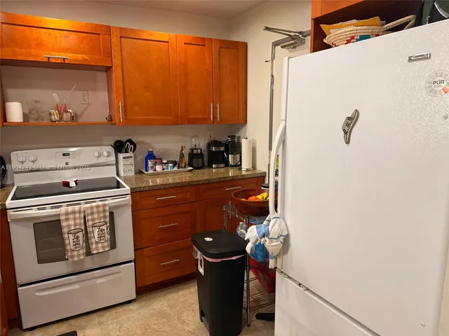 a bedroom with furniture and a flat screen tv