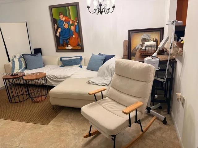 a large white bed in a white room