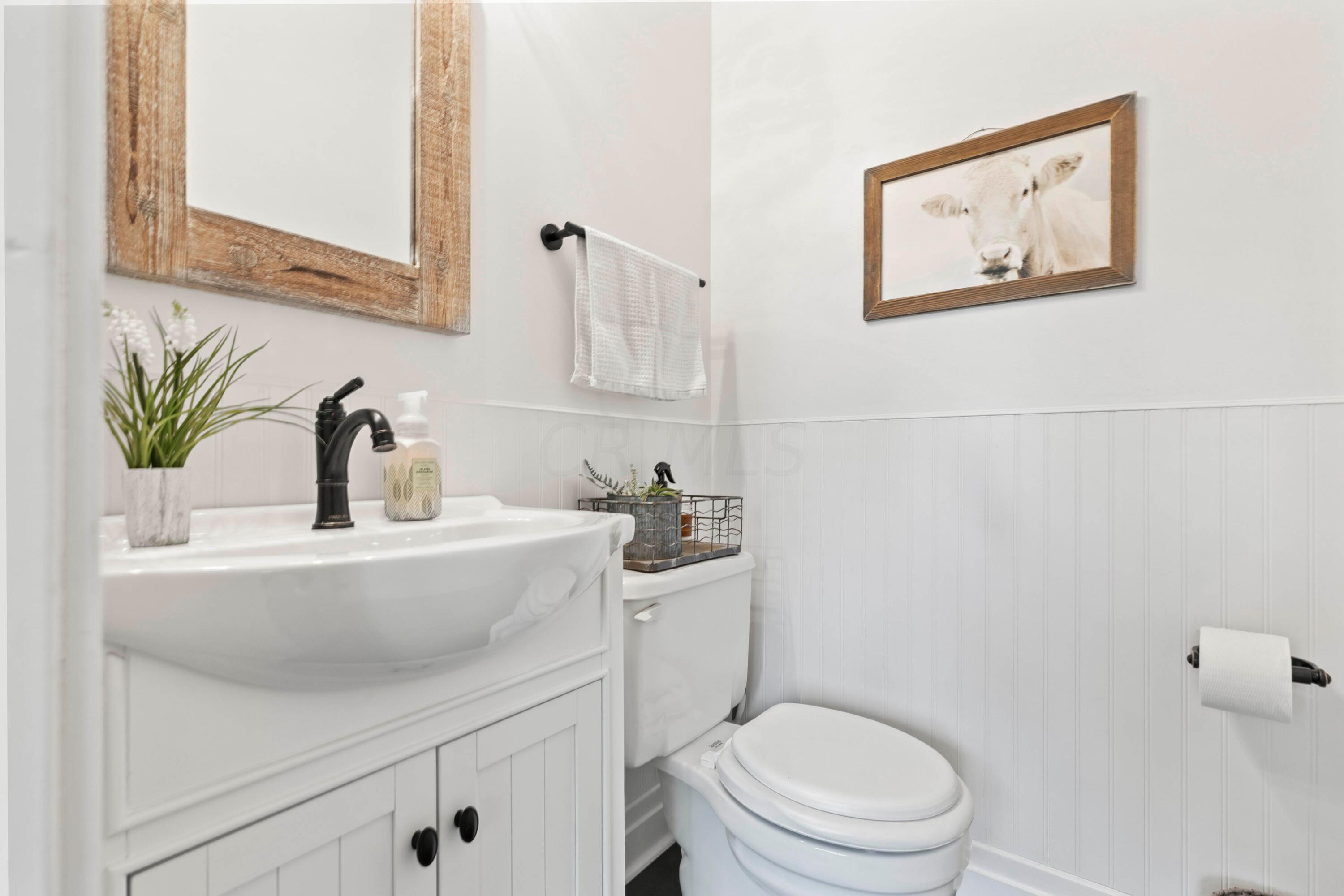 6262 Duffy Road Delaware, OH 43015 - Photo 28 of 96 • Ceramic tile flooring
• Ivory painted & shiplap walls
• Enclosed vanity with single
bowl sinktop
• 2 bulb wall light
• Ceiling exhaust
• Mirrored medicine cabinet
• Mirror is negotiable
