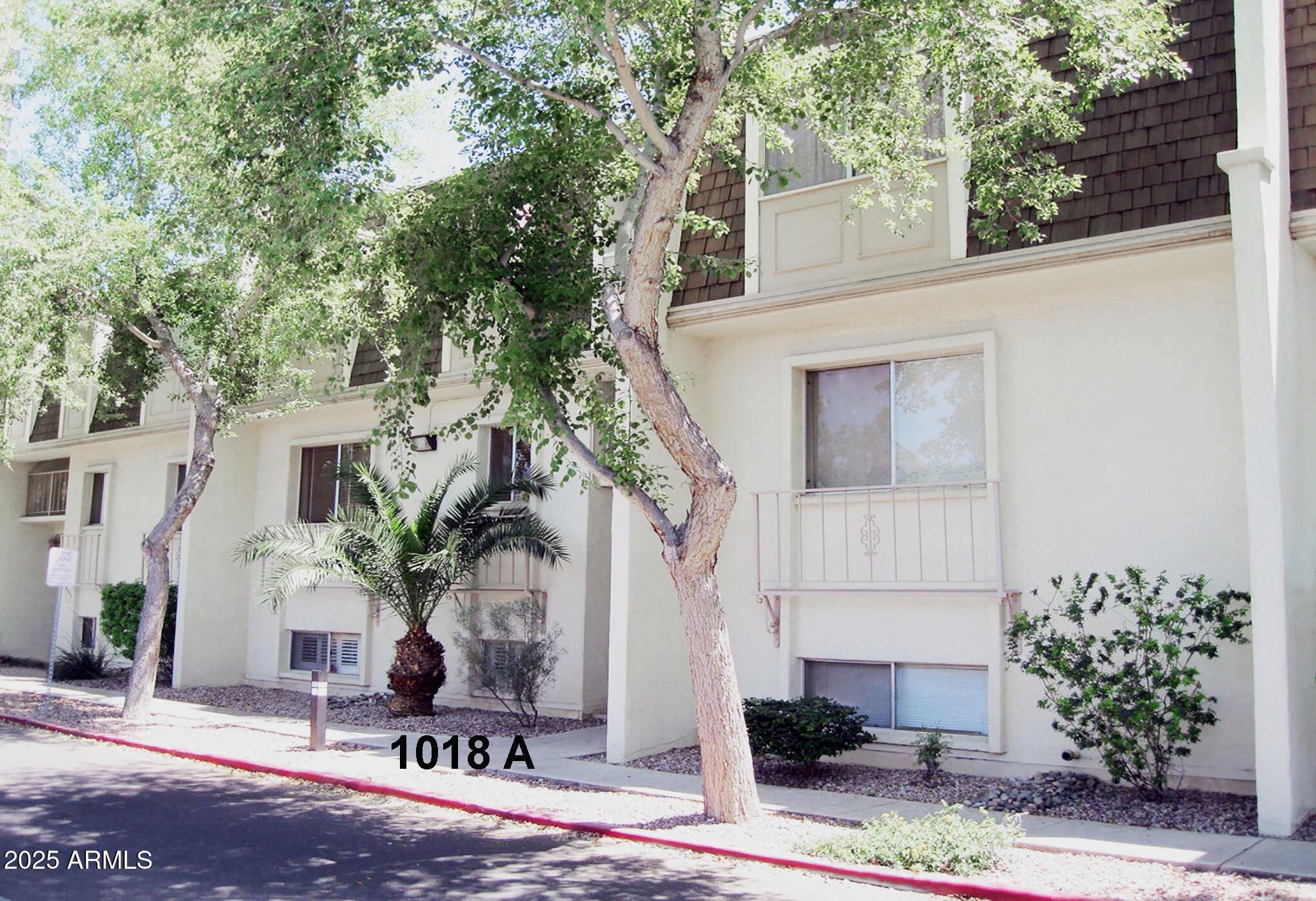 1018 East Osborn Road, Unit A Phoenix, AZ 85014 - Photo 18 of 19 a front view of a house with a tree