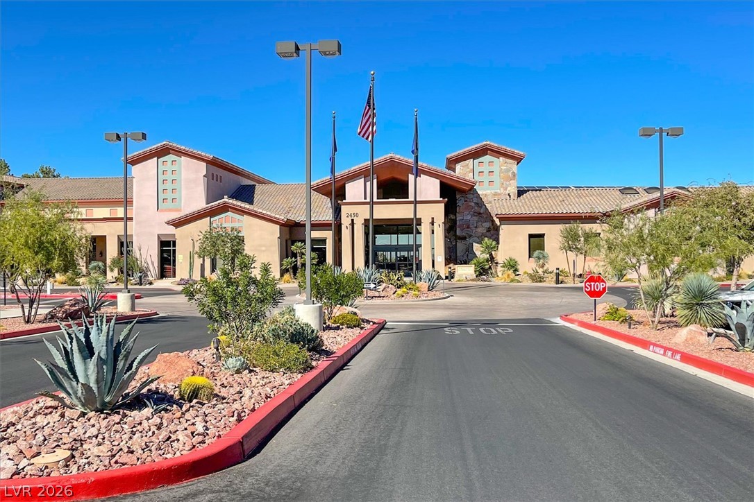 1823 Baton Rouge Street Henderson, NV 89052 - Photo 43 of 60 A spacious driveway leads directly toward the striking exterior of this modern clubhouse.