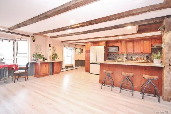 a view of a kitchen with furniture and a kitchen