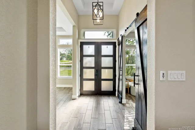 a view of an entryway and livingroom
