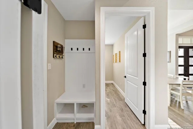 a view of a hallway with white walls