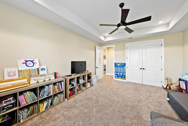 a living room with lots of furniture and a flat screen tv