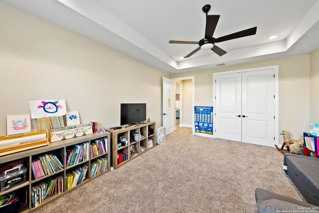 a living room with lots of furniture and a flat screen tv