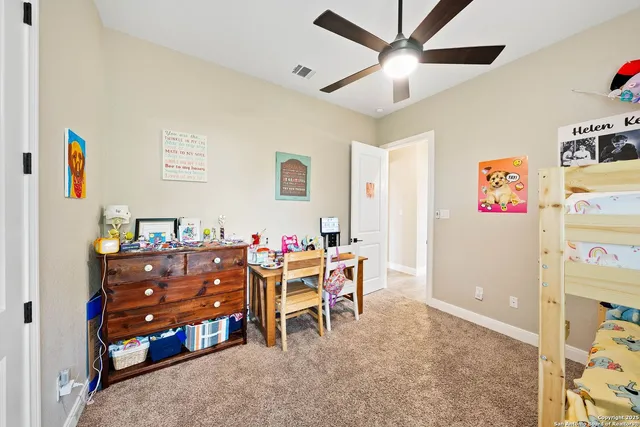 a room with furniture a desk and a chair