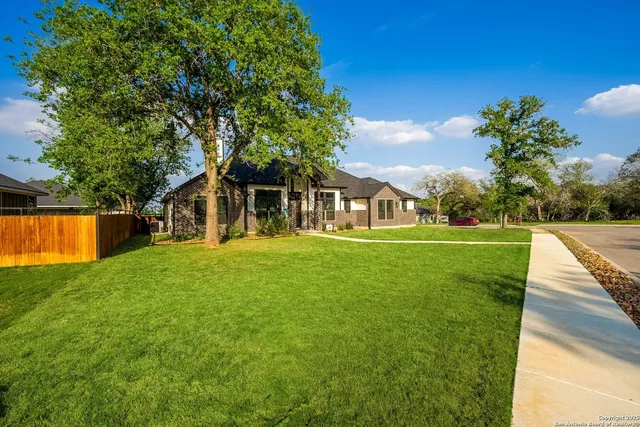 a view of a house with a big yard