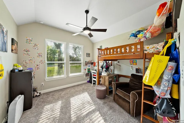 a bedroom with furniture and a window