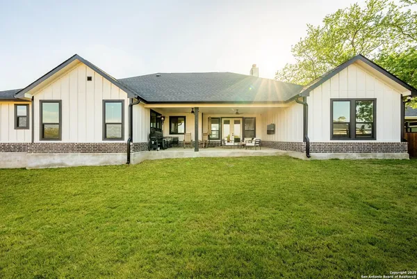 a front view of house with yard and green space