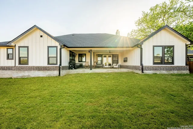 a front view of house with yard and green space
