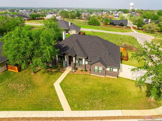 a aerial view of a house with pool