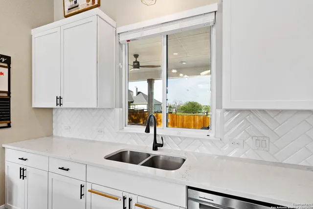 a kitchen with a sink and a window