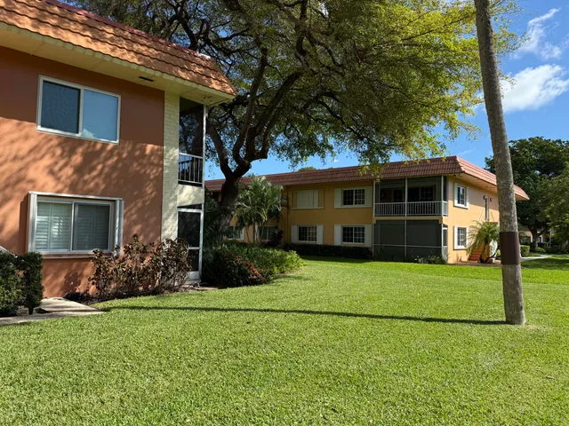 a view of house with yard
