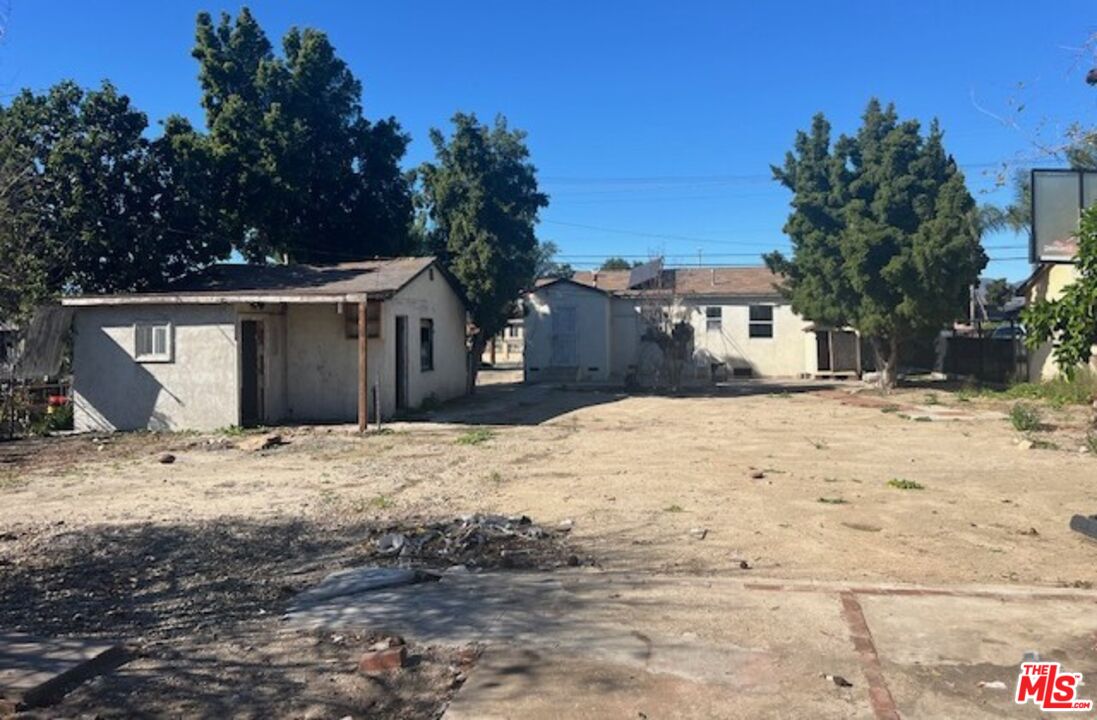 13678 Filmore Street Pacoima, CA 91331 - Photo 3 of 6 a view of a house with a yard covered in snow